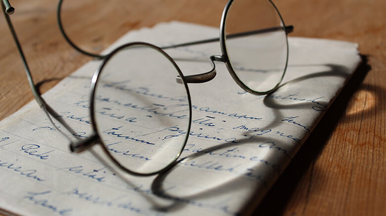 Reading Glasses on Hand Written Letter