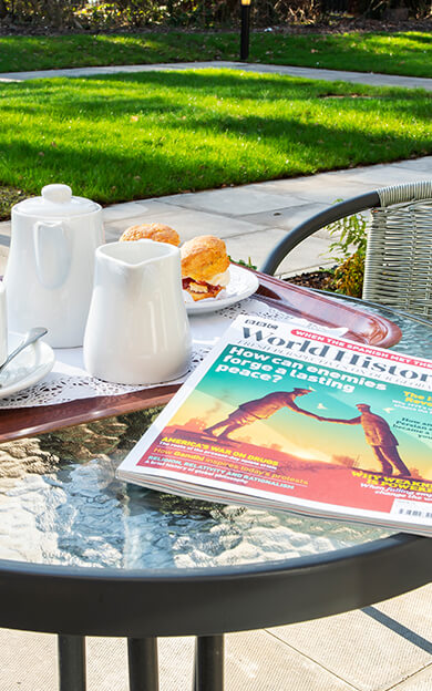 Outdoor Table With Magazine & Cream Tea