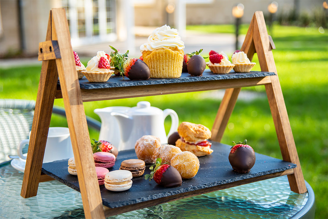 afternoon tea spread on patio table