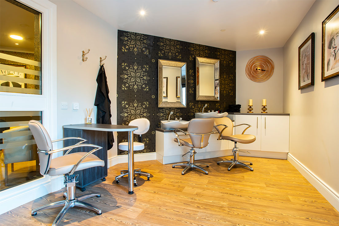 luxury hair salon in a care home with accessible sinks and chairs