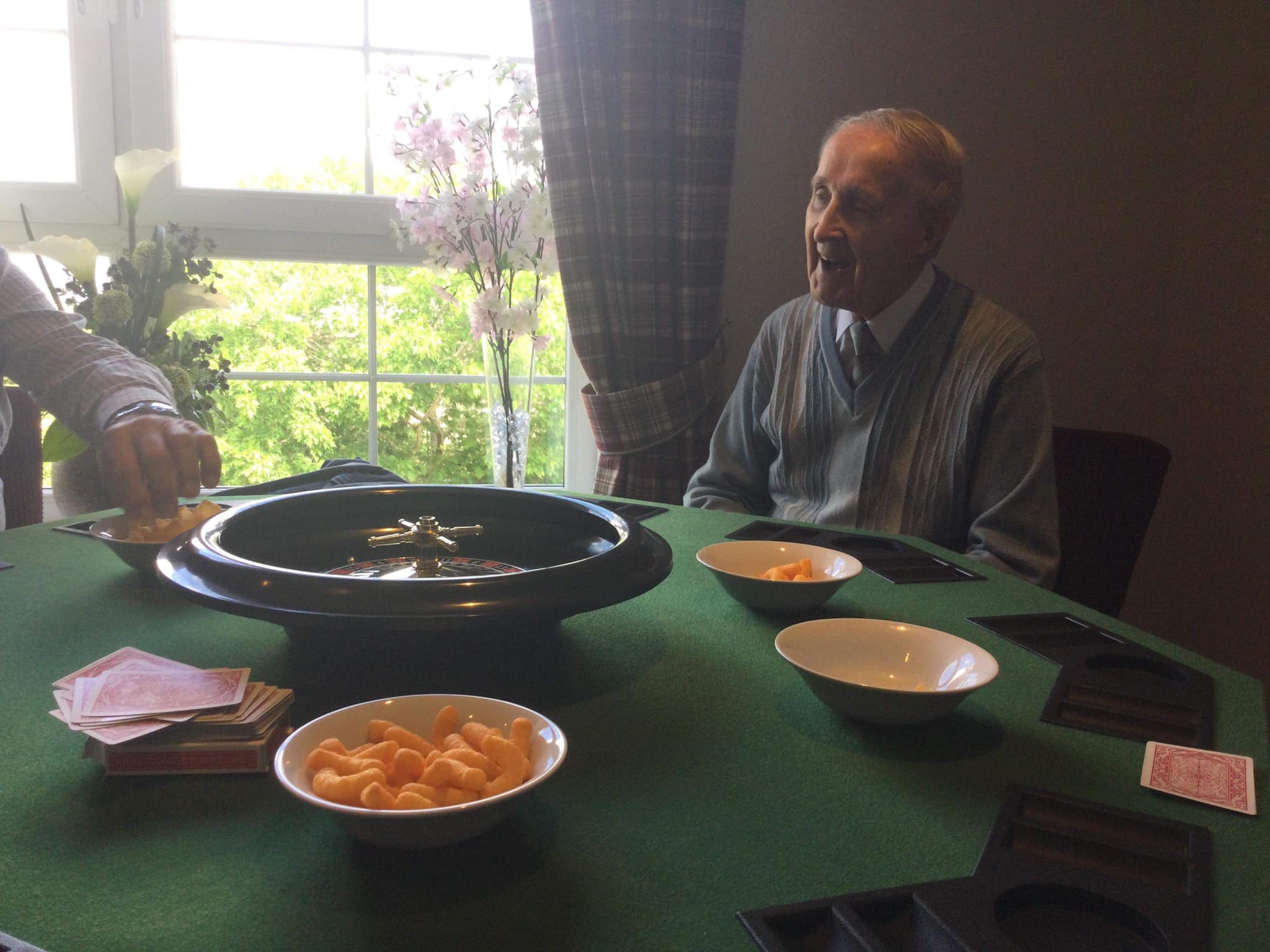 Male Residents Playing Casino Games with Snacks