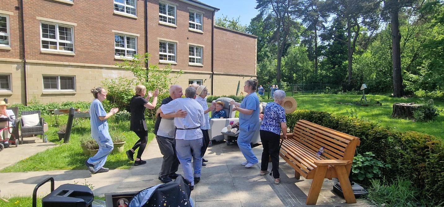 residents dancing in the garden
