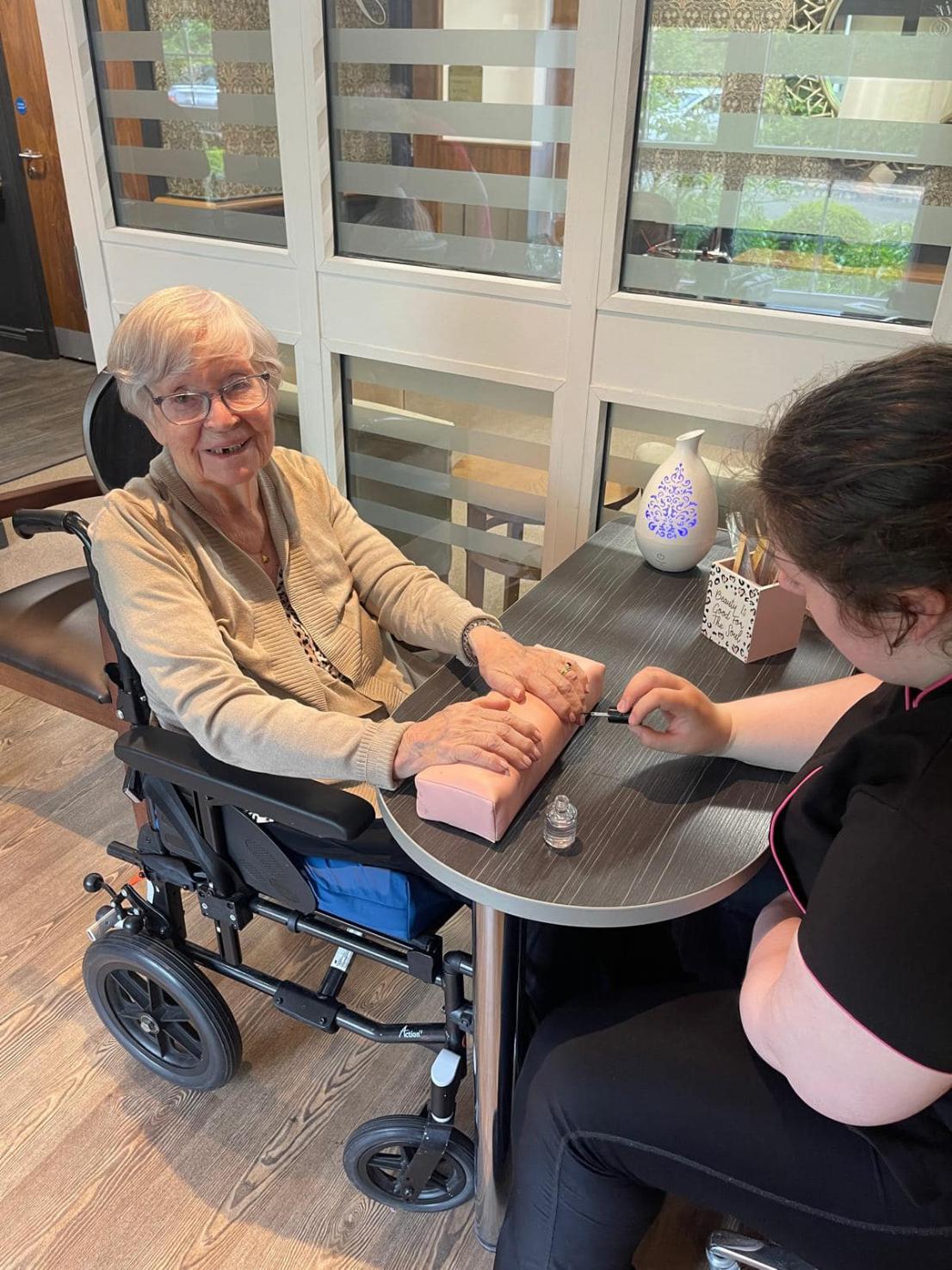resident getting their nails done