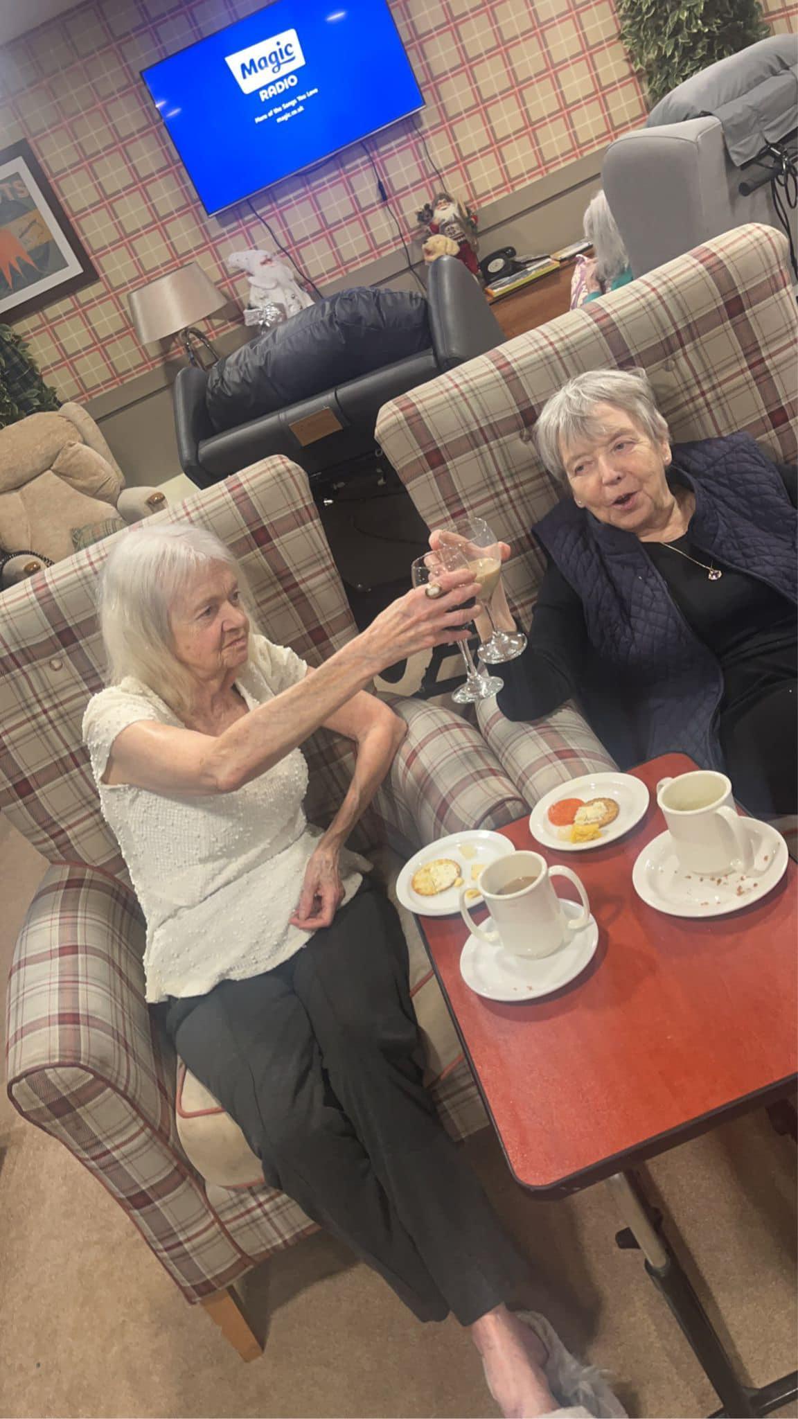 residents cheer-sing their drinks