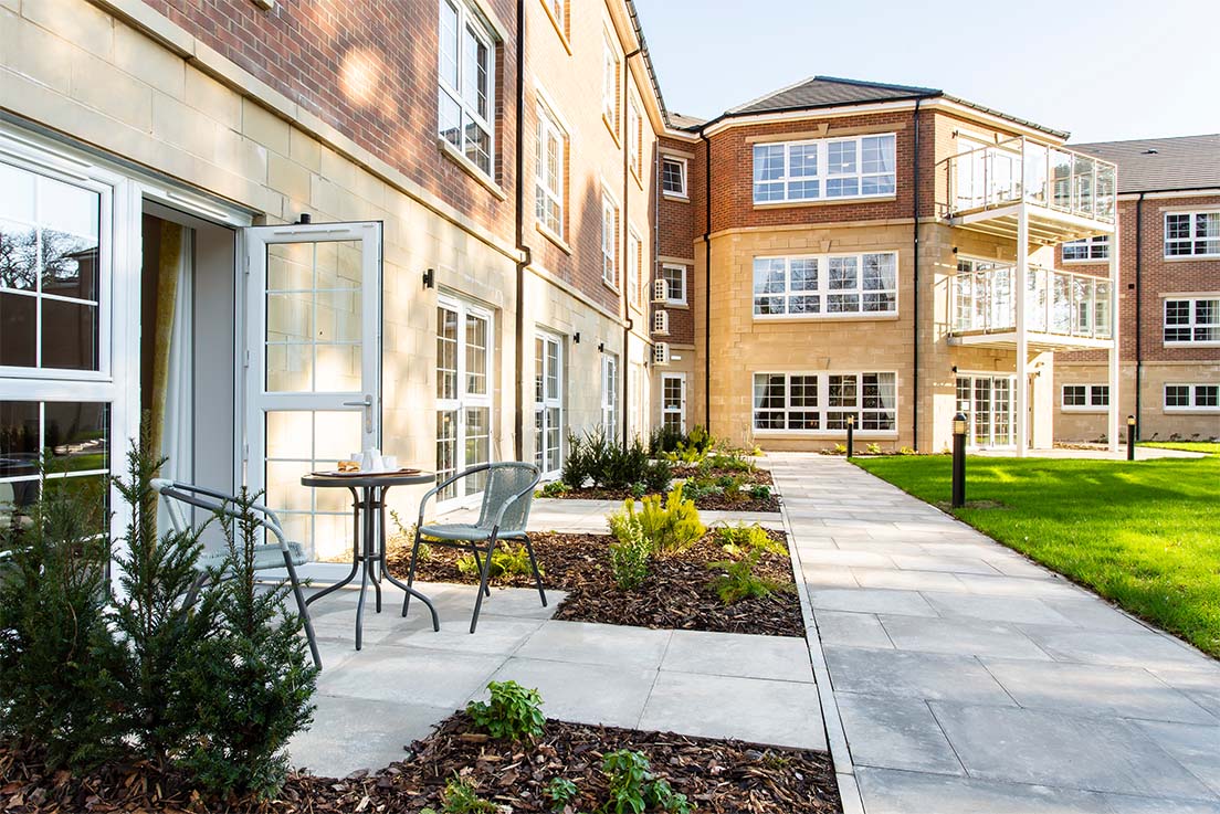 care home patio area with table and chairs