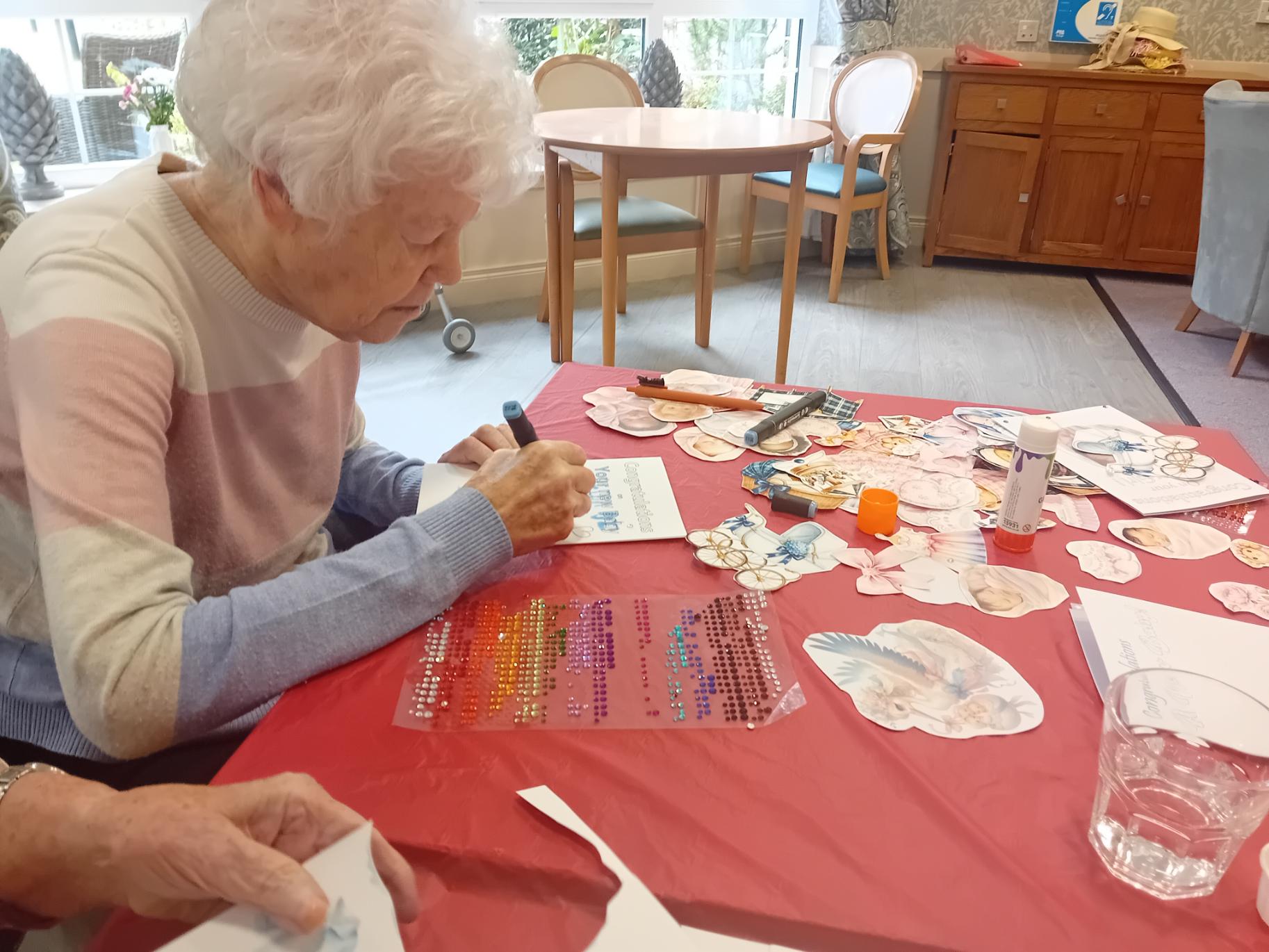 care home residents making cards for loved ones
