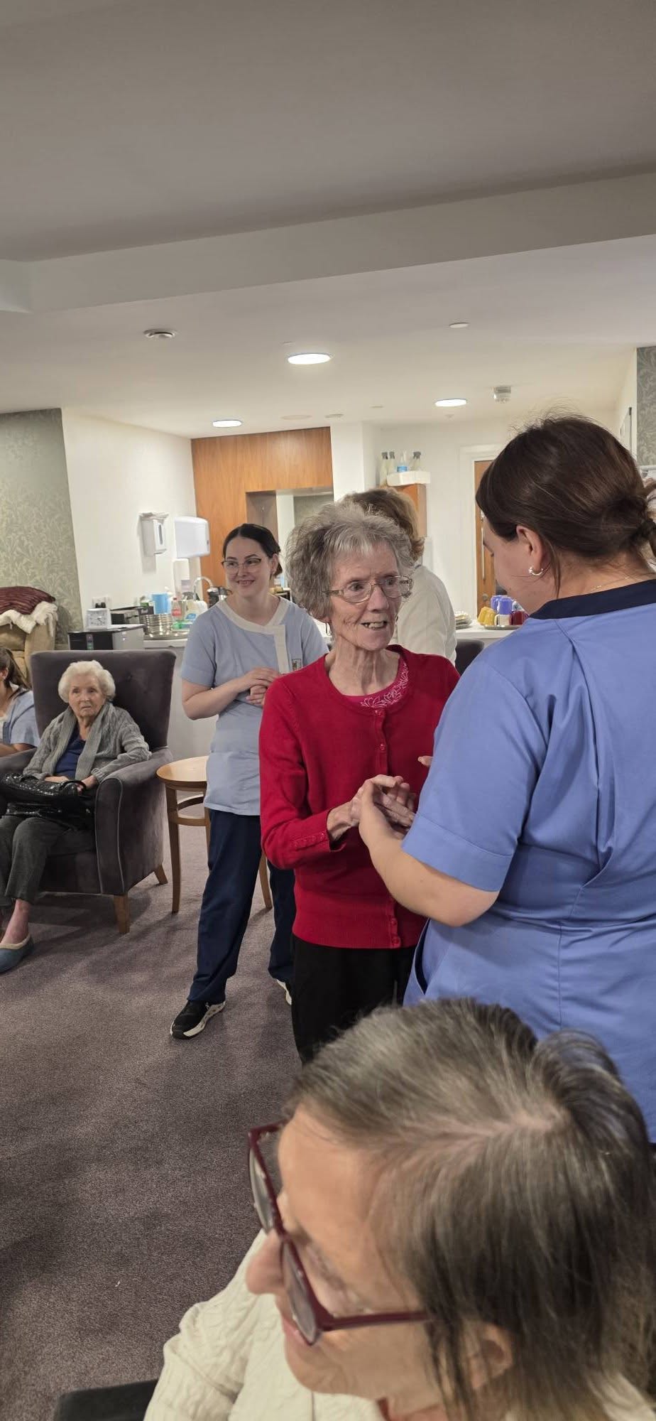 residents dancing with staff at bothwell castle care home